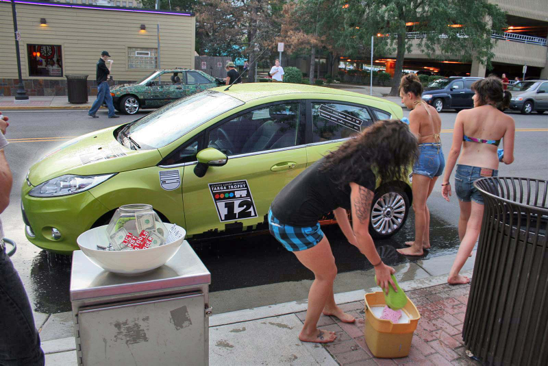 Illustration for article titled Noir Leather Bikini Car Wash Meetup Pictures